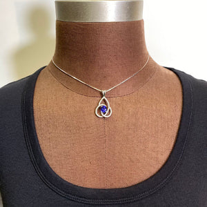 oval tanzanite pendant diamond swirl white gold