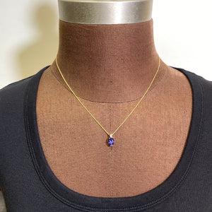 oval tanzanite pendant single diamond accent yellow gold