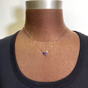 round tanzanite floating white gold