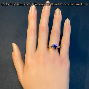 yellow gold ring with trilliant tanzanite