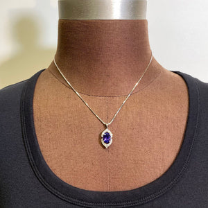 white gold and diamond oval tanzanite pendant