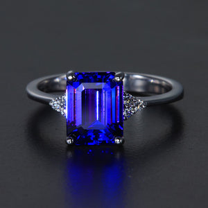 White Gold Emerald Cut Tanzanite Ring with Side Diamonds
