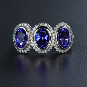 White Gold Three Stone Tanzanite and DIamond Halo Ring