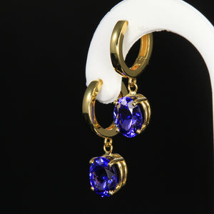 Yellow gold huggie tranzanite earrings
