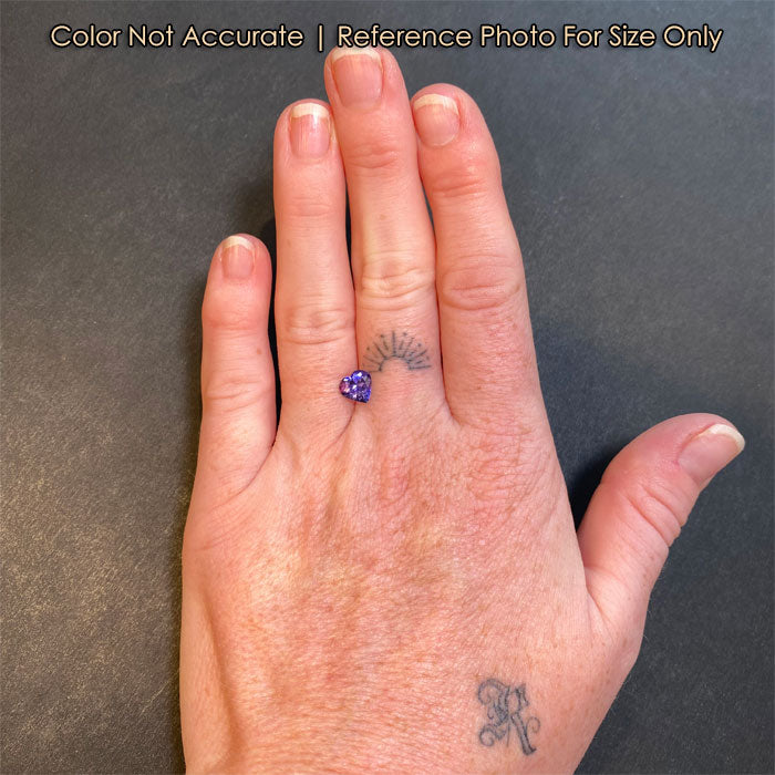 tanzanite gemstone heart shaped on hand