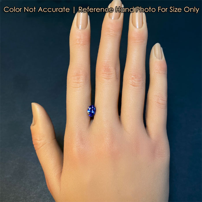 tanzanite gemstone on hand violet blue color