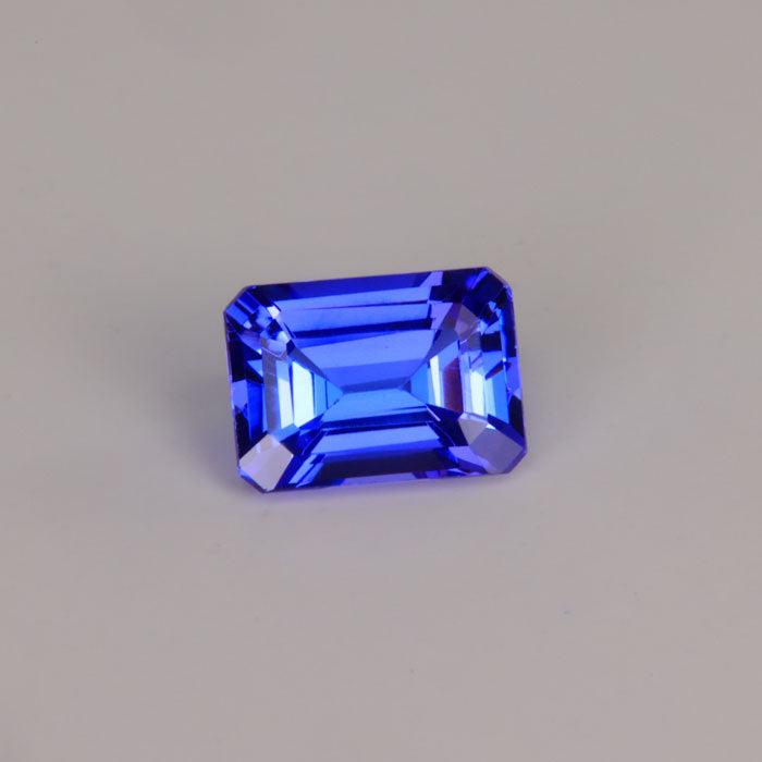 emerald cut tanzanite violet blue gemstone
