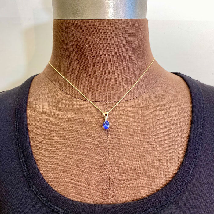 yellow gold tanzanite pendant oval cut gemstone