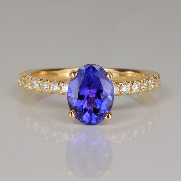 blue violet yellow gold oval tanzanite and diamond gem ring