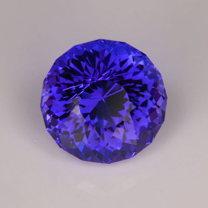 blue violet round portuguese tanzanite gem