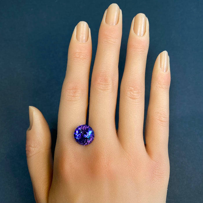 tanzanite round portuguese gem on hand