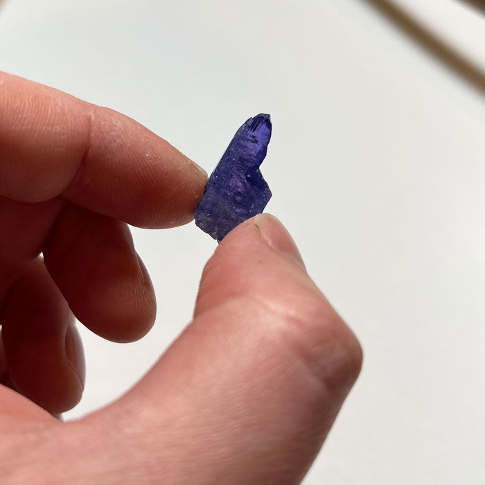 unique tanzanite mineral specimen in hand