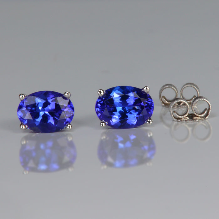 tanzanite stud earrings in white gold oval cut 