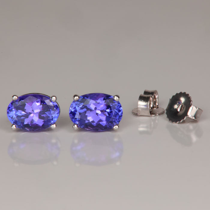 oval cut blue violet tanzanite stud earrings white gold