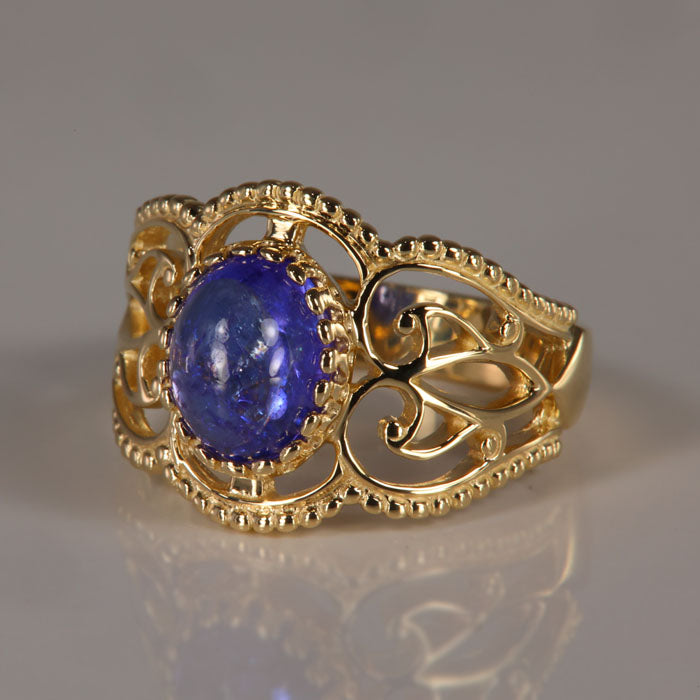 tanzanite and gold ring oval cabochon cut 