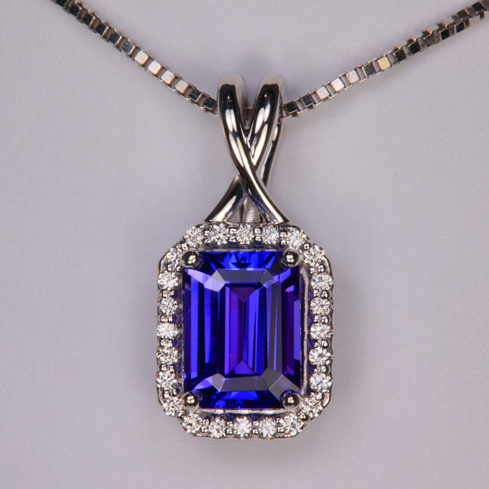 blue violet emerald cut tanzanite gemstone pendant in white gold with diamonds
