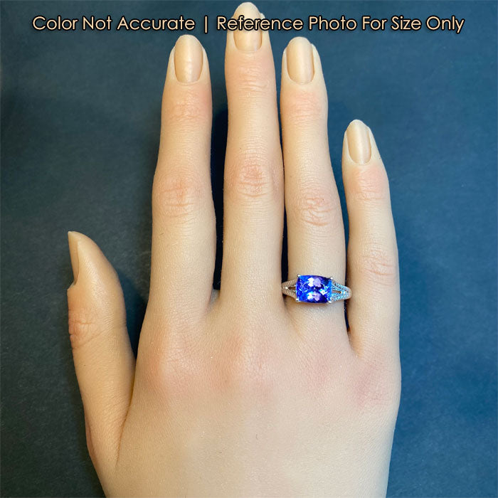 white gold tanzanite gemstone ring on hand