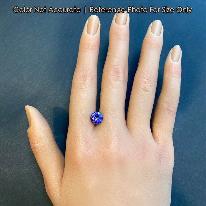hand size comparison to tanzanite gemstone