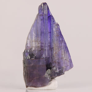 Uncut tanzanite crystal specimen purple blue