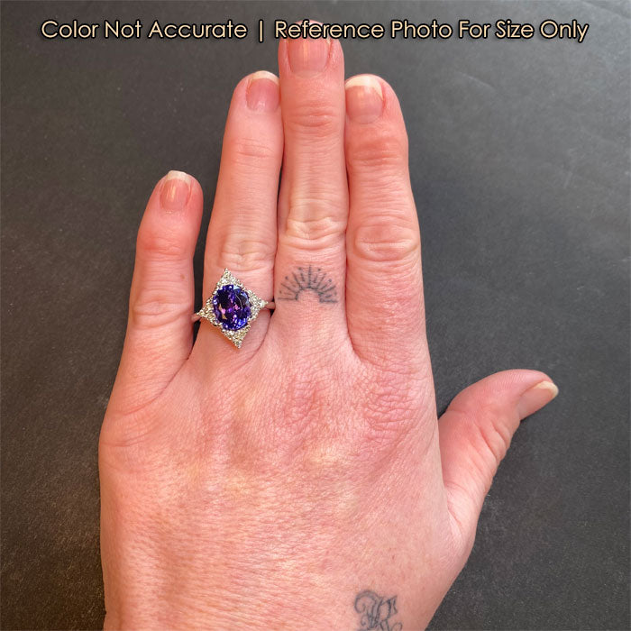 white gold oval tanzanite and diamond ring size to hand