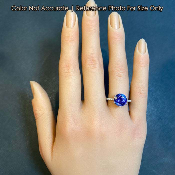 white gold tanzanite gemstone ring on hand