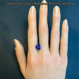 oval blue violet tanzanite size on a hand