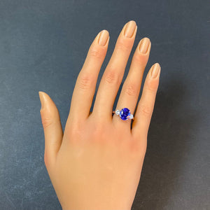 oval tanzanite ring yellow gold white gold diamonds