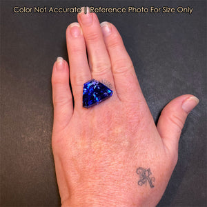 shield blue tanzanite gemstone on hand