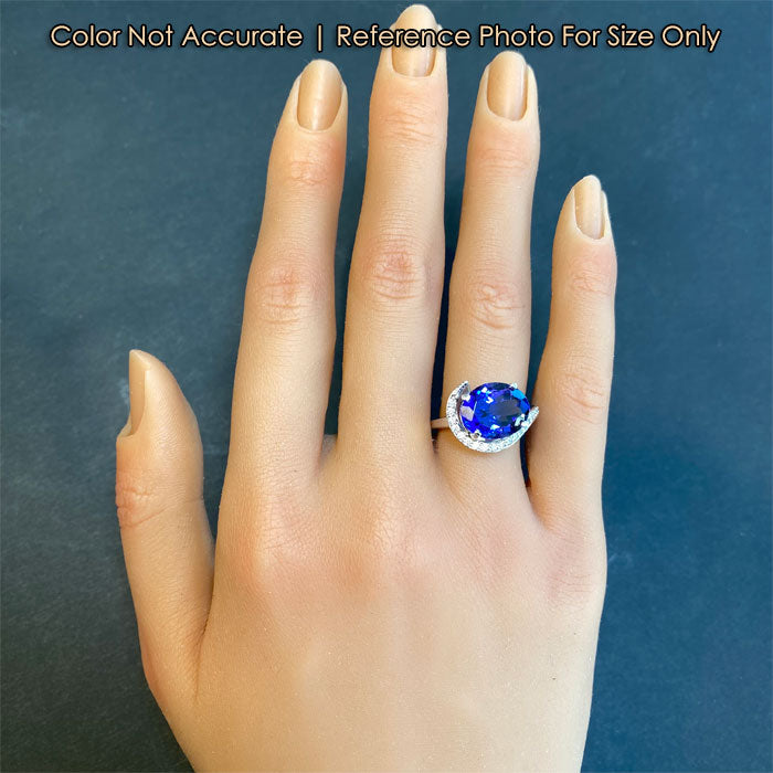 mostly blue tanzanite and diamond ring size to hand