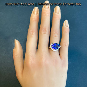 mostly blue tanzanite and diamond ring size to hand