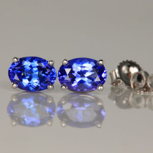 Four prong oval tanzanite earrings in 14k white gold