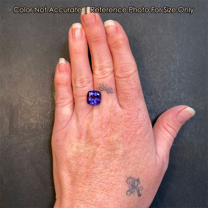 tanzanite gem on hand size reference