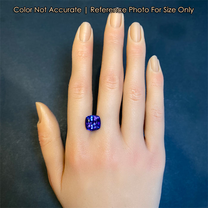 tanzanite gem on hand with square cushion cut