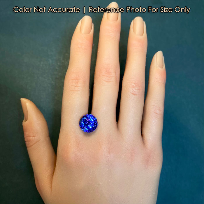 tanzanite gem on hand round brilliant cut