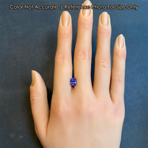 antique cushion tanzanite gem on hand