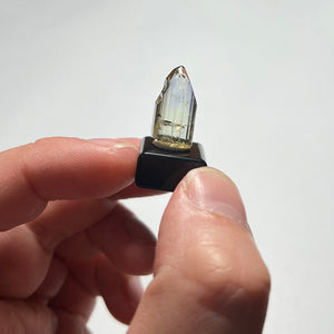 natural tanzanite crystal in hand