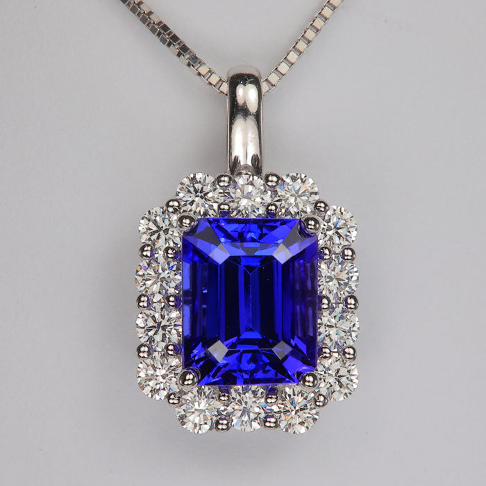 white gold and diamond accented mostly blue color tanzanite gemstone pendant 