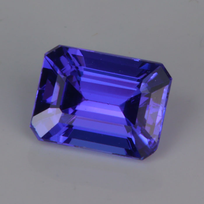 emerald cut mostly violet tanzanite gemstone 