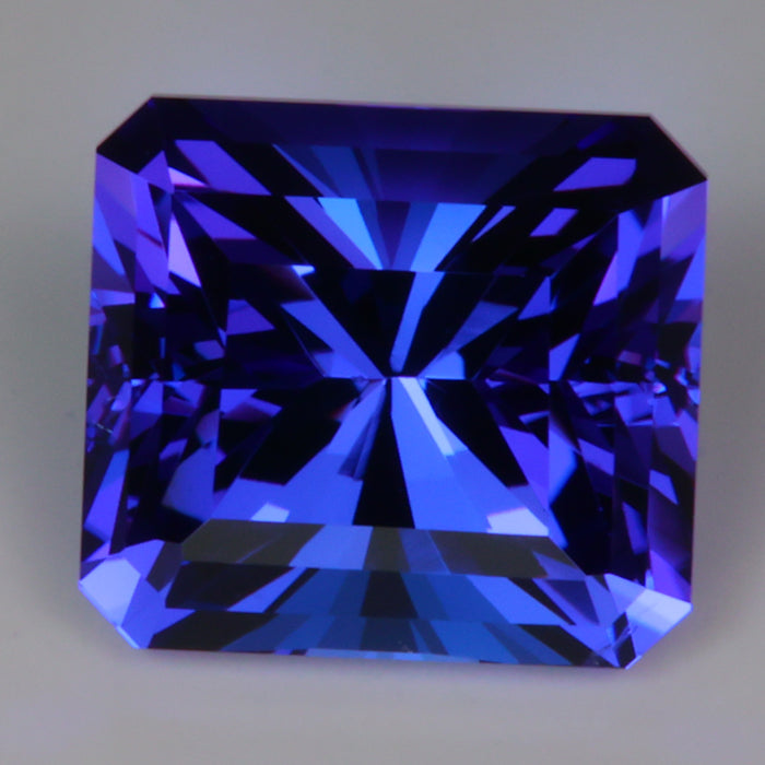 beautiful tanzanite gemstone emerald cut red flash
