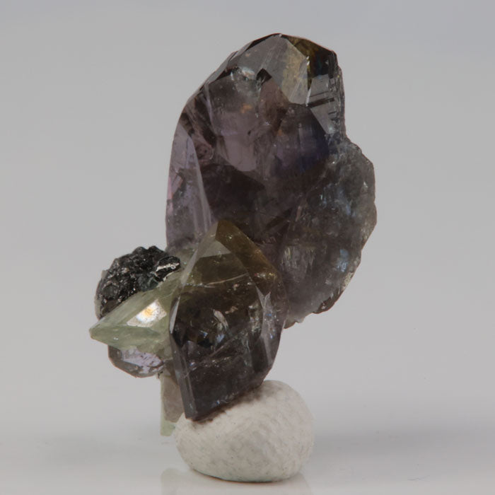 raw natural tanzanite and diopside crystal