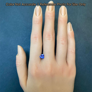 tanzanite gem heart shaped on hand for size