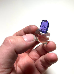 saturated tanzanite mineral specimen in hand