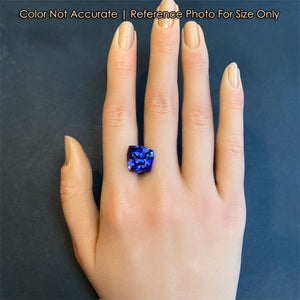 violet blue tanzanite gemstone on hand