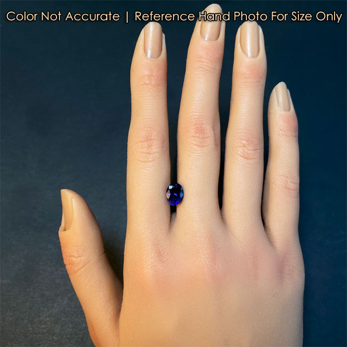 tanzanite gemstone oval cut on hand

