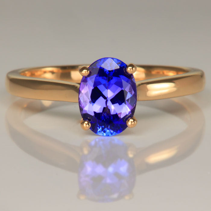 Oval cut tanzanite solitaire ring yellow gold