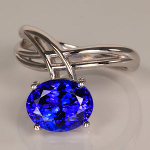 oval cut tanzanite criss cross white gold ring