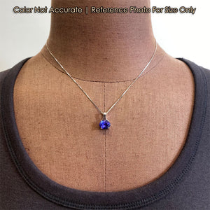 blue violet oval cut tanzanite and white gold pendant