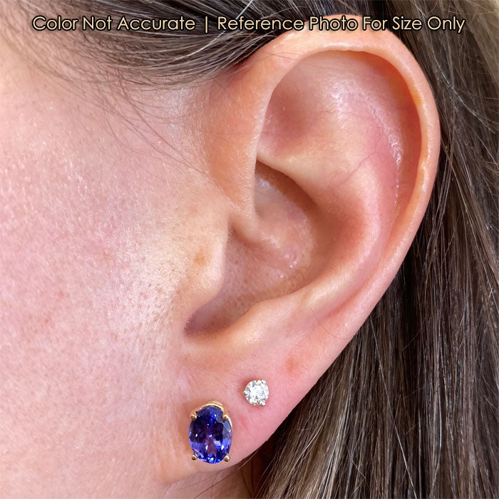 yellow gold oval cut tanzanite stud earrings