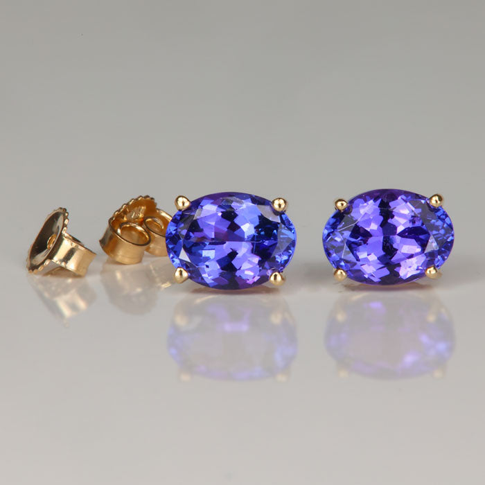 yellow gold oval cut tanzanite stud earrings