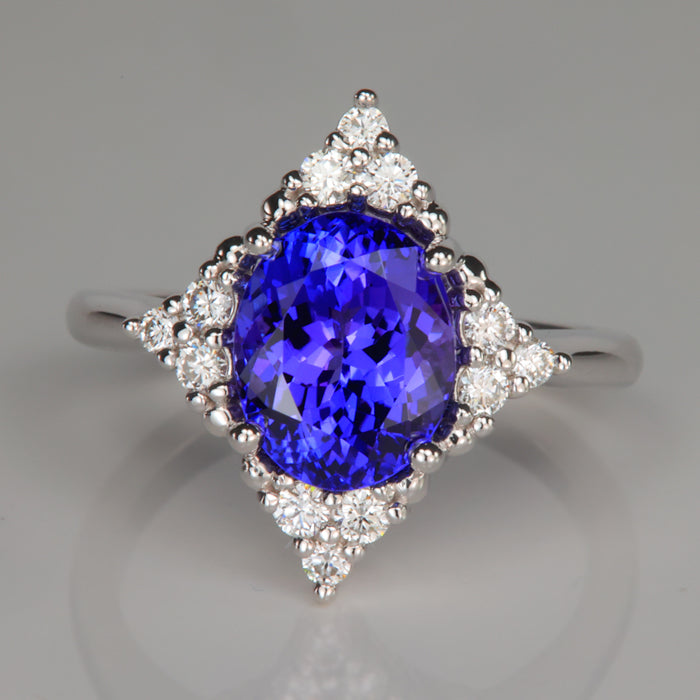 blue violet oval cut tanzanite and diamond white gold ring
